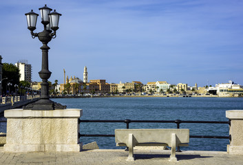 Fototapeta na wymiar panoramic views of the waterfront of Bari, Puglia - Italy.In the foreground the characteristic lamppost