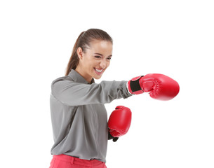 Businesswoman in boxing gloves on white background