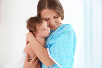 Mother holding baby at hospital
