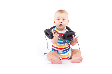 cute baby boy in colorful shirt with headphones