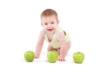 Fototapeta na wymiar cute cheerful little boy with apples