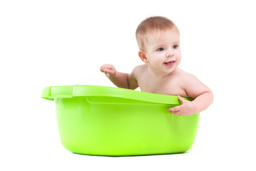 cute attractive baby boy take bath in tub