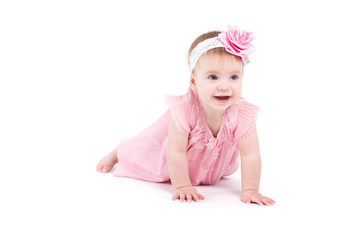 cute beautiful baby girl in pink dress and pink wrap