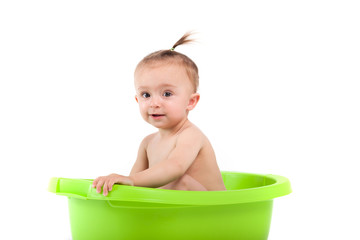 cute attractive baby girl take bath in tub