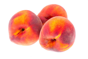 Whole ripe peaches on white background