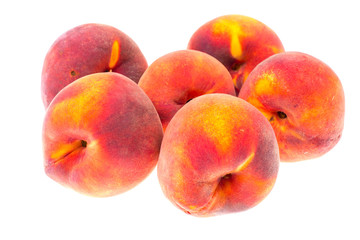 Whole ripe peaches on white background
