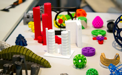 Many abstract models printed by 3d printer close-up.