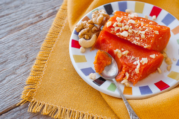 Pieces of sweet baked pumpkin with nuts. The Turkish dish is Kabak Tatlısı.