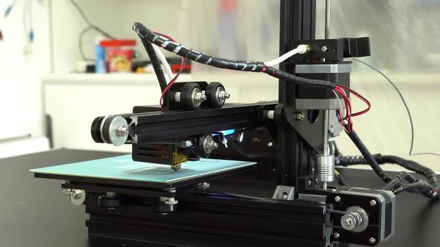 Small home 3D printer prints plastic toy  filament