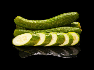 Whole long cucumbers with slices