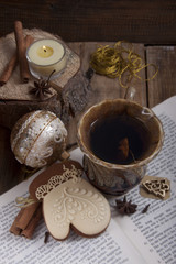 New Year composition with a cup of tea and a gingerbread