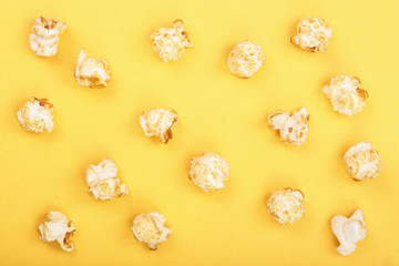 Popcorn on yellow background. Top view. Flat lay pattern