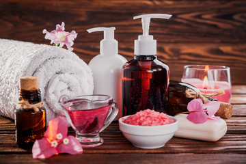 Spa essentials including natural oils, salt, soap and candle. Organic cosmetics concept