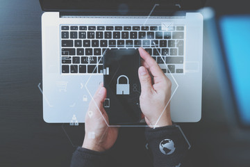 cyber security internet and networking concept.Businessman hand working with VR screen padlock icon...