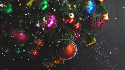 Obraz na płótnie Canvas Greeting Season concept.hand setting of ornaments on a Christmas tree with decorative light