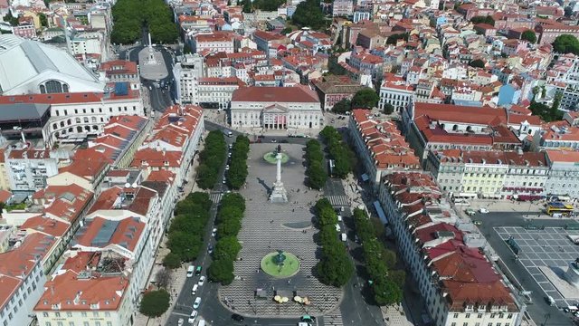 Aerial Rossio Square is popular name of Pedro IV Square in Portuguese Praca de D. Pedro IV in city of Lisbon Portugal and located in Pombaline Downtown very popular tourist destination 4k quality
