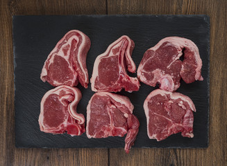 Lamb chops on a slate board, raw and uncooked, 