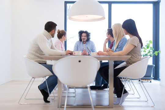 Startup Business Team At A Meeting at modern office building