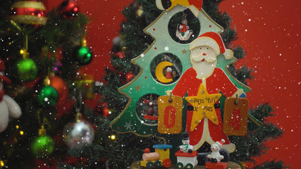 Greeting Season concept. Santa Claus show 4 days till Xmas with ornaments on a Christmas tree with decorative light