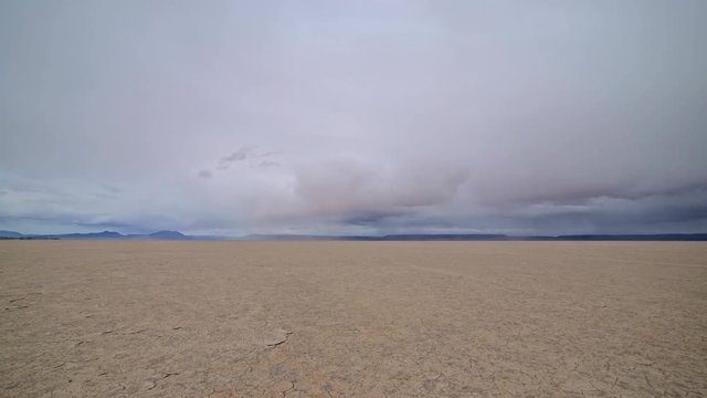 Colorful desert playa cracked earth Alvord Desert and storm 2
