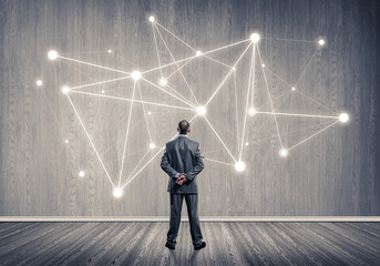 Obraz premium Connection lines drawn on concrete wall as symbol for networking