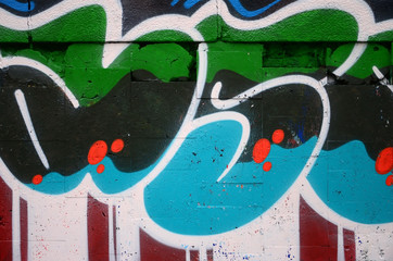 A fragment of graffiti drawing using contours, applied to the wall with the help of cans with...