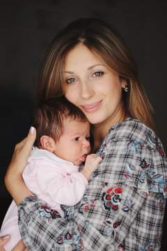 young mother with cute newborn baby