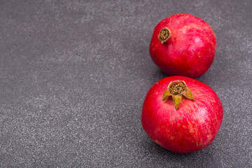 Ripe red garnet on gray stone