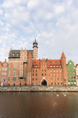 View of old buildings along the Long Bridge waterfront at the Main Town in Gdansk, Poland, in the daytime. Copy space.