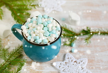 Obraz na płótnie Canvas Cup of Chocolate with Marshmallows, Christmas Decorations on Wooden table, Pine Branch, Snow Down, Toned Photo
