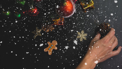Obraz na płótnie Canvas Greeting Season concept.hand setting of ornaments on a Christmas tree with decorative light