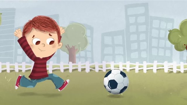 Niño jugando al futbol en el parque