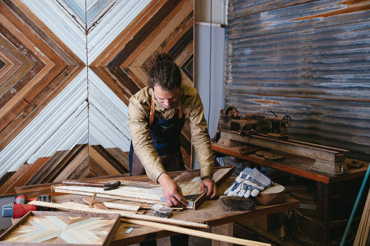 Man working on his art in workshop studio
