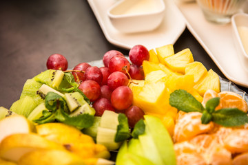 Fruits on plate with passionfruit