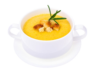 Tasty pumpkin puree soup in white soup tureen