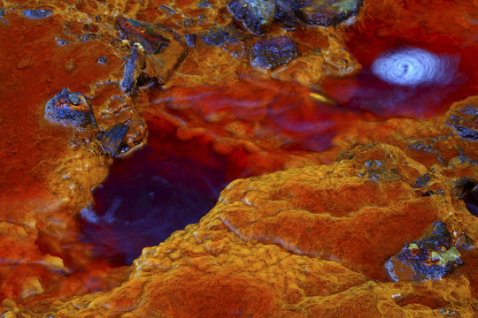 Aerial shot oxidised old mining iron minerals in water Rio Tinto