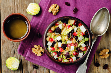 Shredded brussel sprout apple dried cranberry walnuts salad