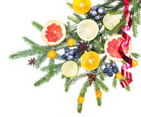 New Year and Christmas branch of spruce, decorated with fruits