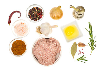 Raw ground chicken, herbs and spices for cutlets