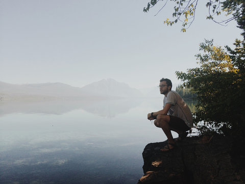Man looking out over Lake McDonald, Glacier Nat Park