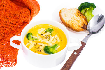 White bowl with chicken cheese broccoli soup