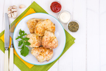 Chicken cutlets with ketchup and mayonnaise