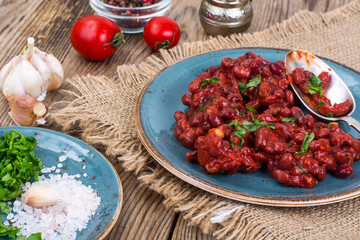 Baked hot beans in tomato sauce