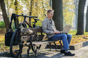 The man with a laptop.