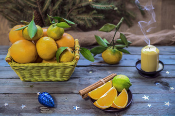 New Year's fruits in the basket. Oranges and tangerines for the festive table.