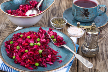 Vinaigrette salad with beets, potatoes, carrots and peas