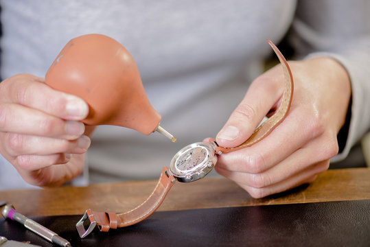 Female watch repair expert
