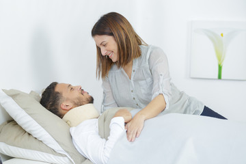 wife caring about her ill husband lying in boyfriend