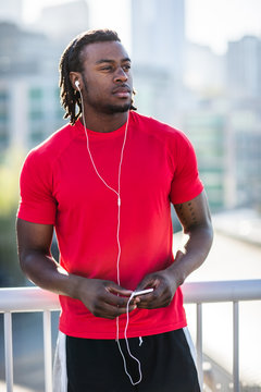 Male athlete listening to music
