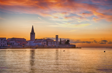 Panoramic view of Porec, during sunset with cloudy sky. Croatia, Adriatic coast